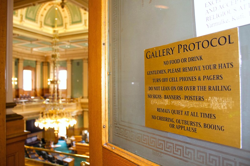 The posted rule prohibiting "apparel expressing political statements" in state House and Senate galleries was seen scratched out on Wednesday, August 14.