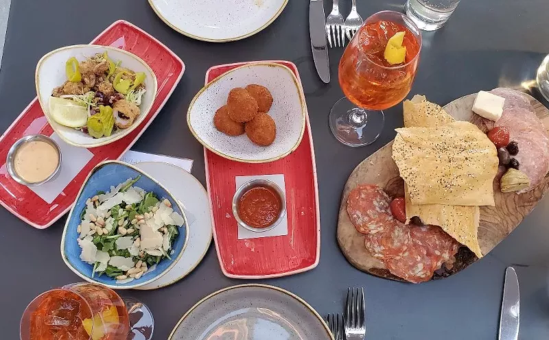 Image: A spread of food from Chow Morso Osteria in downtown.