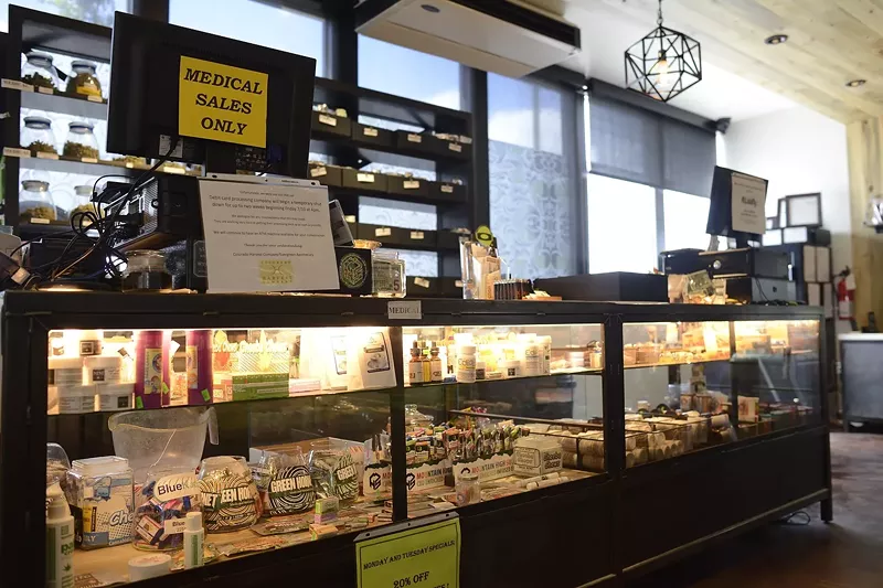 Image: Many dispensaries are still cash-only because cannabis is federally illegal.