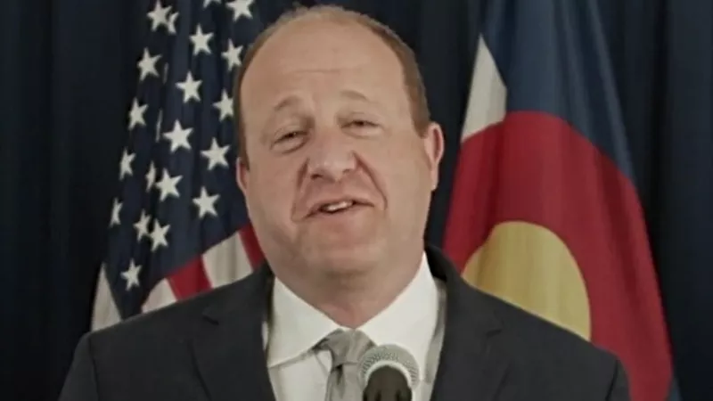 Image: Governor Jared Polis as seen in a May 2021 press conference.