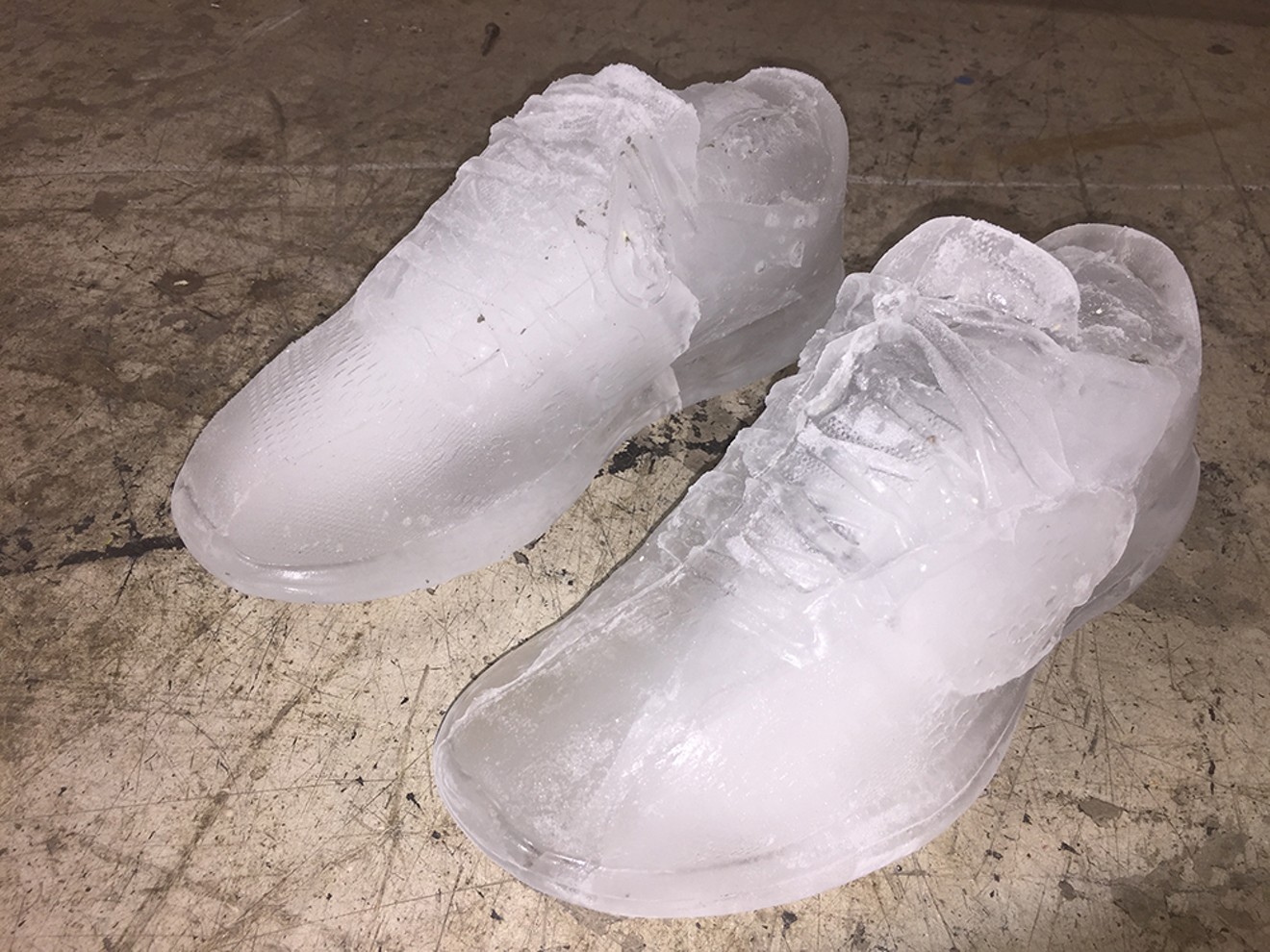 The artist's shoes cast in ice, 2019.