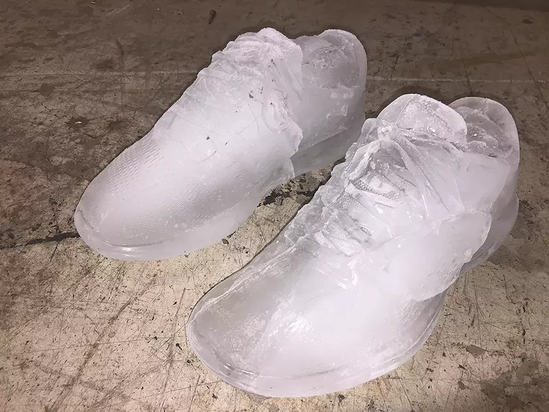 Image: The artist's shoes cast in ice, 2019.