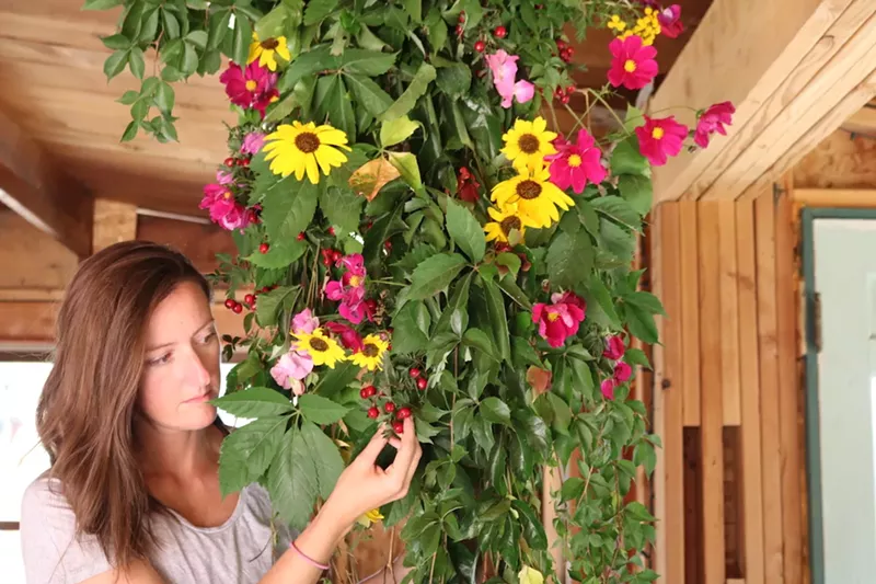 Image: Jaime Kopke working on a plant installation in an old cabin.