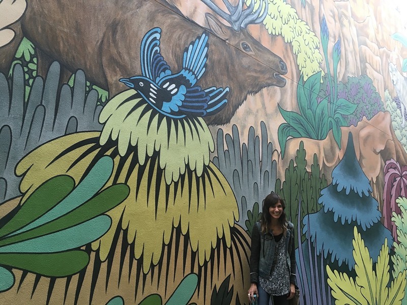 Leah Brenner Clack with a mural by Rather Severe commissioned by Conscience Bay Company in 2016.