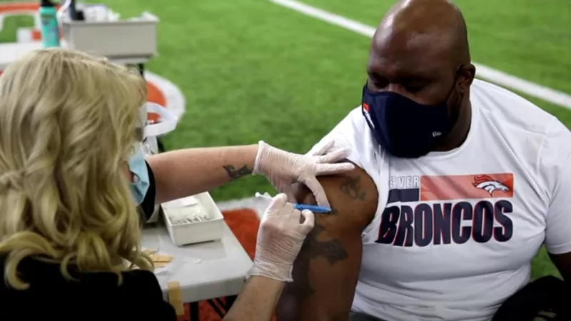Image: An image from a vaccination event sponsored by the Denver Broncos in April.
