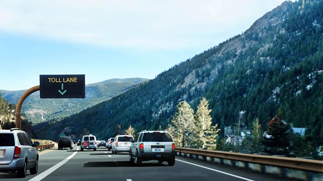 Vehicles driving along the Interstate 70 Mountain Express Lane.
