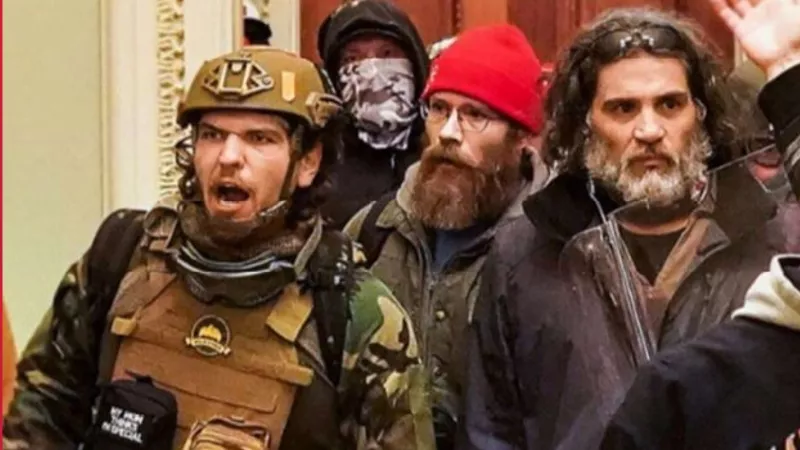 Image: The man at the left of this photo wearing the military gear has been identified as Woodland Park resident Robert Gieswein.