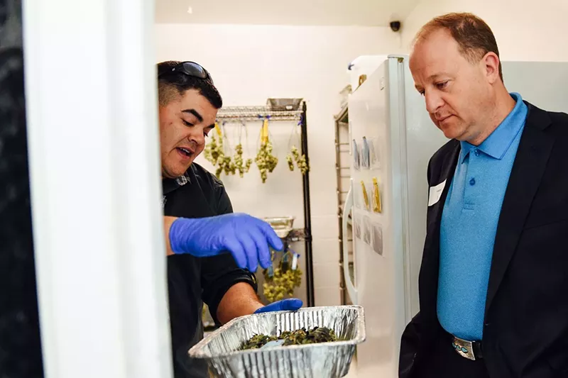 Image: Colorado Governor Jared Polis tours Bgood, a Northglenn dispensary, before taking office in 2018.