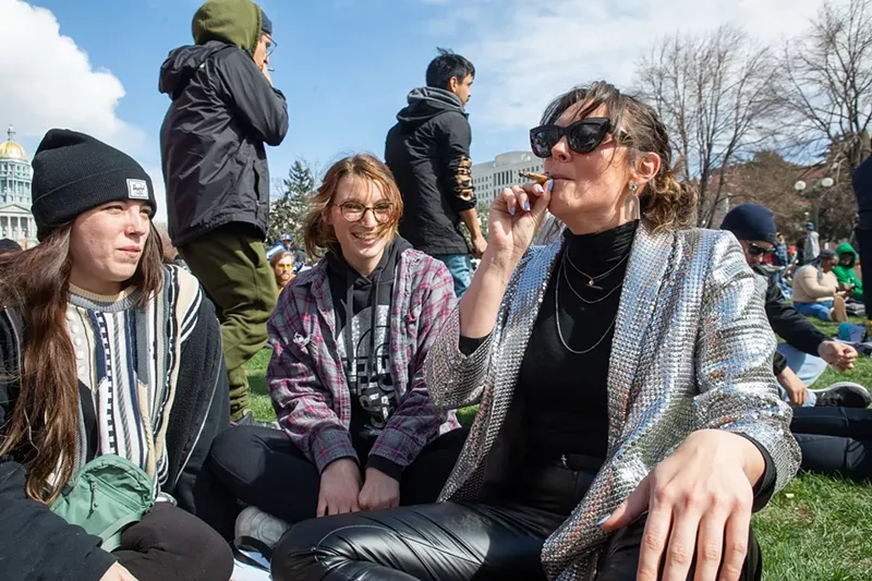 Image: Women smoke marijuana at Civic Center Park in Denver