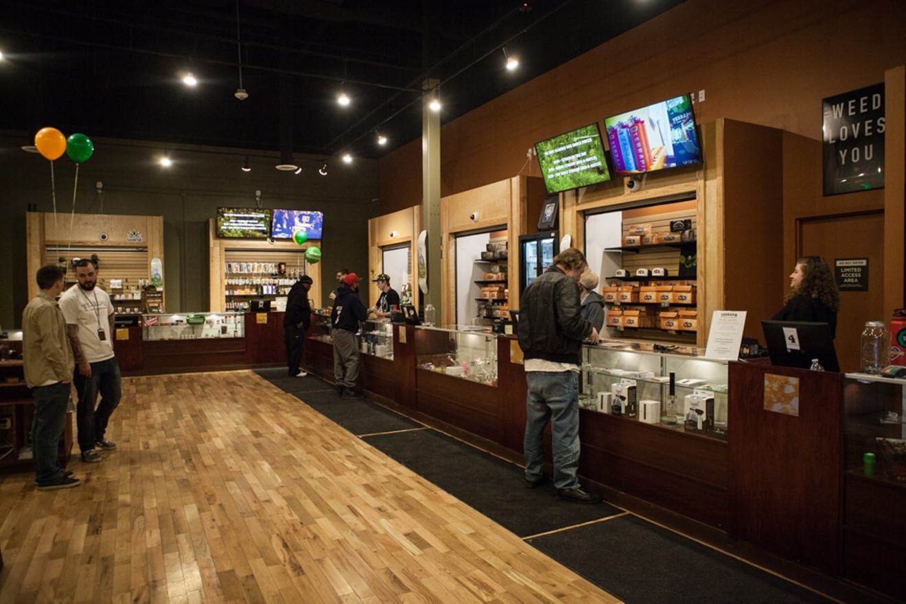 Customers browse a Terrapin Care Station dispensary in Aurora.