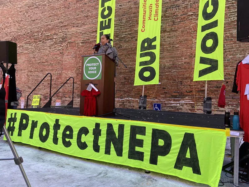 Image: Lyla June Johnston, an environmental activist and member of the Diné nation, speaks at a rally outside the EPA's regional headquarters in Denver.
