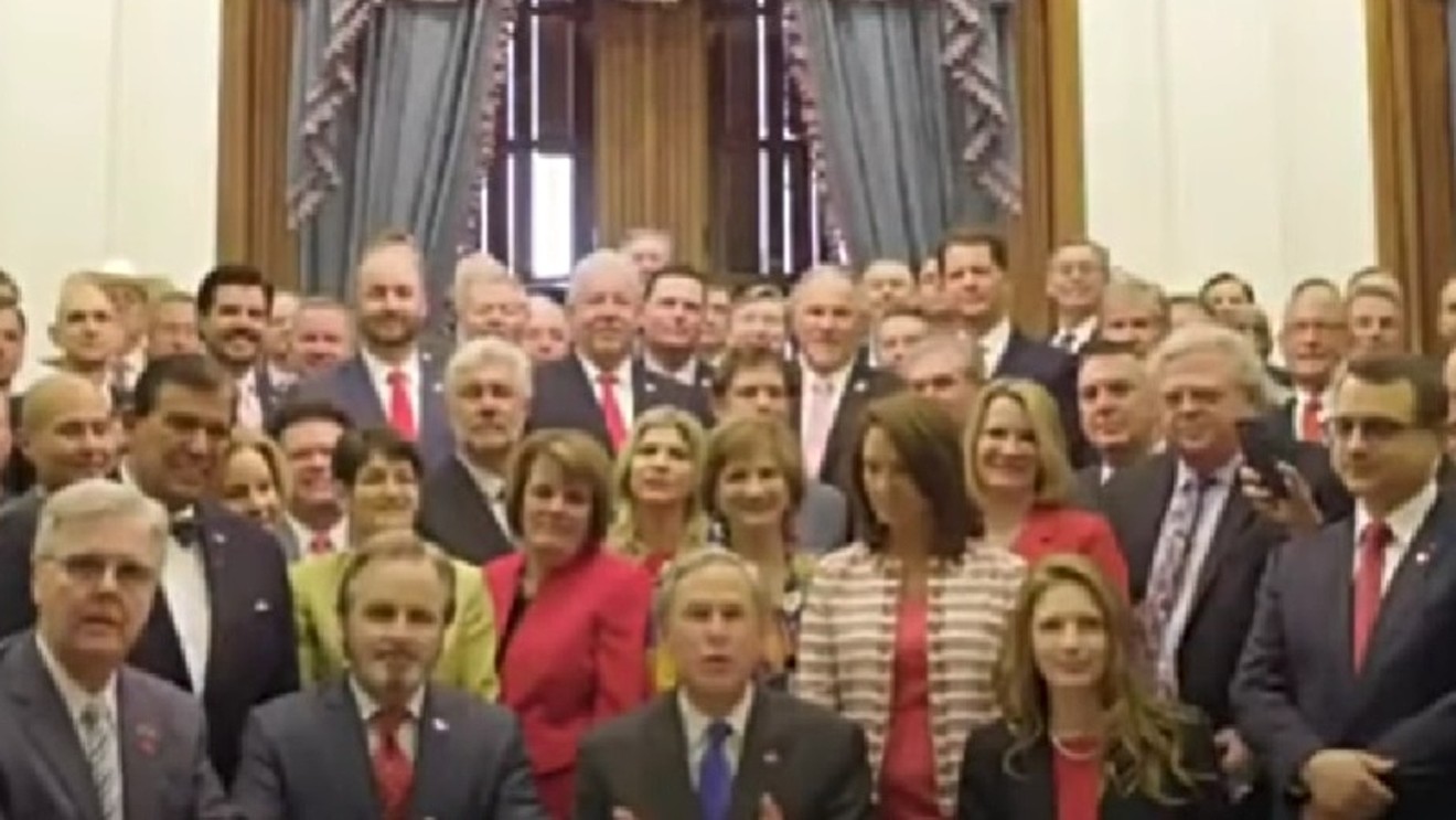 Texas Governor Gregg Abbott (center front, with blue tie) and legislators at the 2021 signing of the so-called Heartbeat Act, the nation's most restrictive abortion measure.