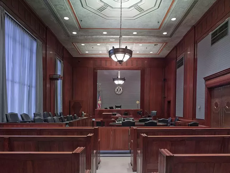 Image: An empty courtroom.