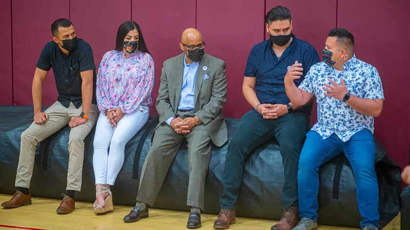 Image: Denver Mayor Michael Hancock, center, during a mid-May visit to a vaccination site.
