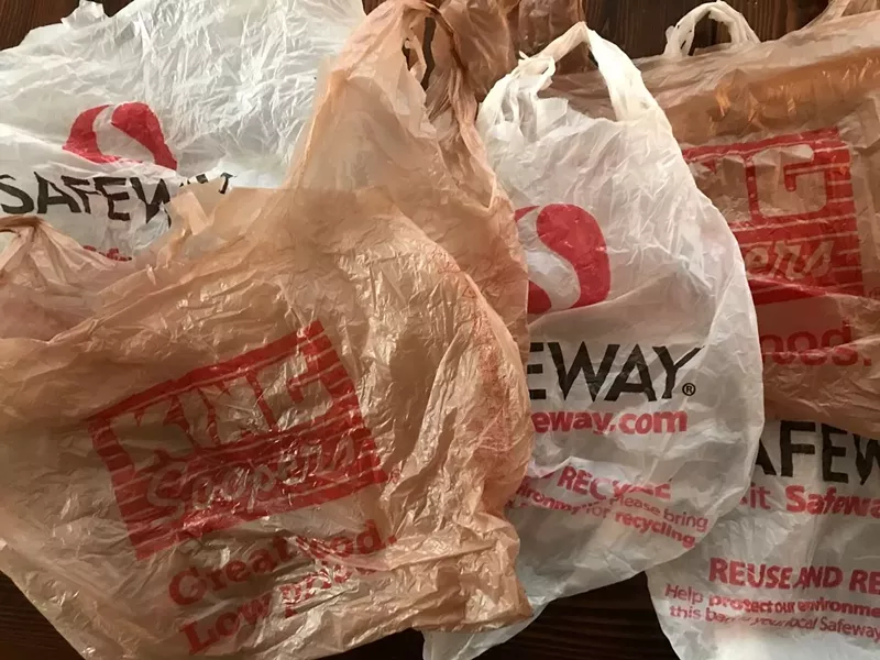 Image: A collection of single-use plastic grocery bags from Safeway and King Soopers.