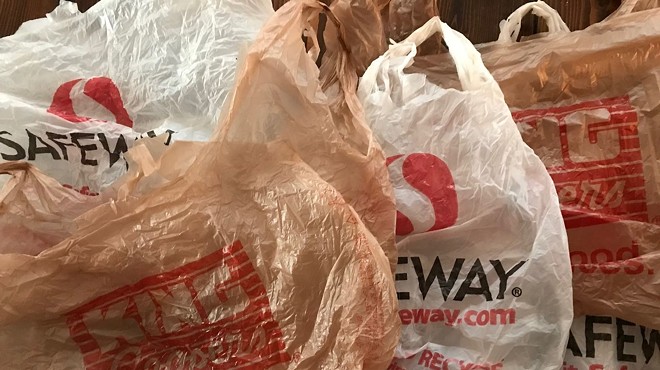 A collection of single-use plastic grocery bags from Safeway and King Soopers.