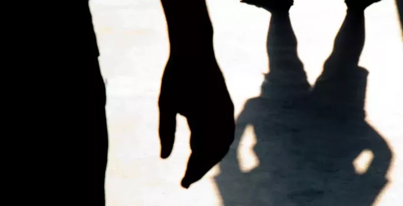 Image: menacing shadow over kid
