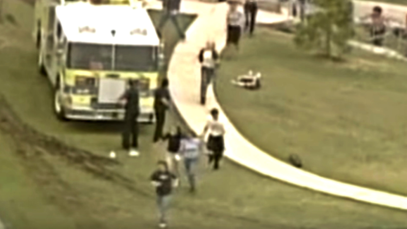 A screen capture from footage of students fleeing from Columbine High School on April 20, 1999.