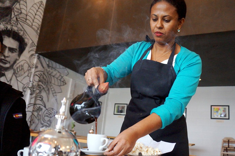 Sarah Gebre pours Ethiopian coffee at Comal.