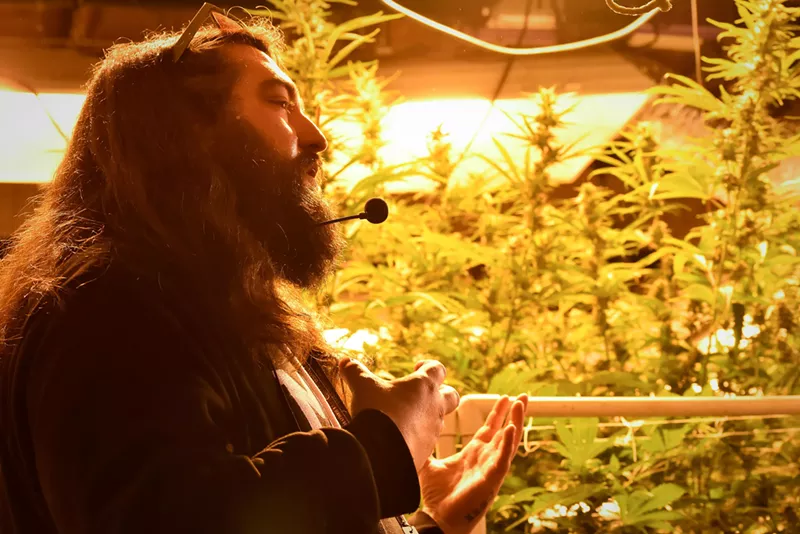 Image: Gage Dunn, one of our Budz and Sudz tour guides, explains the intricacies of a commercial pot grow.