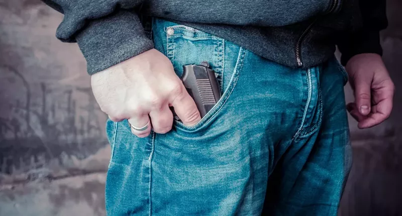 Image: gun in man's jean pocket