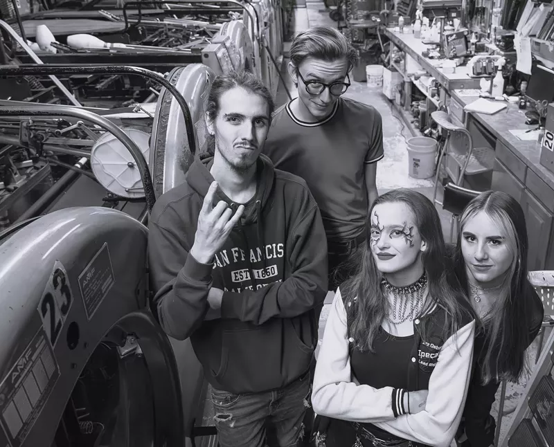 Image: black and white image of four band members