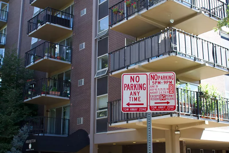 Image: Street parking signs in front of condo