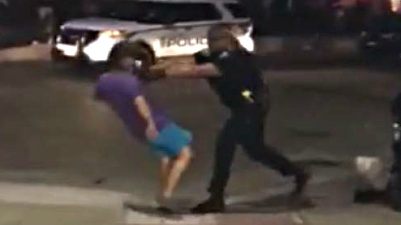 A screen capture of Officer Waylon Lolotai shoving Kelly Clark. See two videos of the incident below.