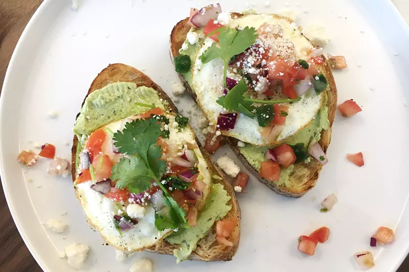 Image: The Huevos Fiesta toast, with avocado butter, eggs, cotija cheese and pico de gallo, at the Corner Beet Cherry Creek.