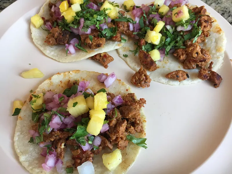 Image: Bits of char flavor the tacos al pastor at Los Carboncitos, which still spit-roasts its meat.