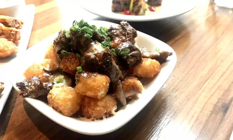 Image: Tater tots make a good stand-in for fries in Courier's poutine.
