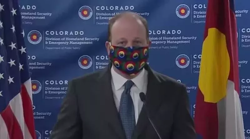 Image: Governor Jared Polis at an April 3 press conference where he first advocated for wearing facial coverings in public.