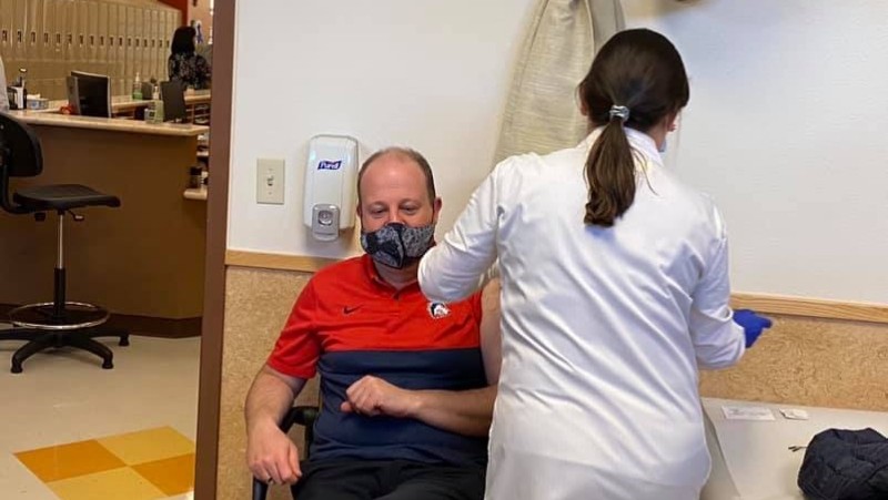 Governor Jared Polis getting vaccinated earlier this year.