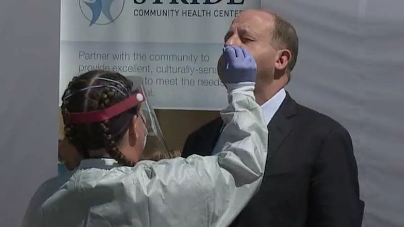 Image: Colorado Governor Jared Polis getting tested for COVID-19 during a May 18 press conference.