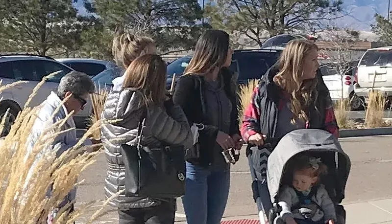 Image: Unmasked groups, including multi-generational families, were common during a November 28 visit to the Outlets at Castle Rock.