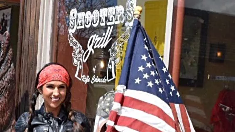 Image: Lauren Boebert showing her colors outside Shooters Grill in Rifle.