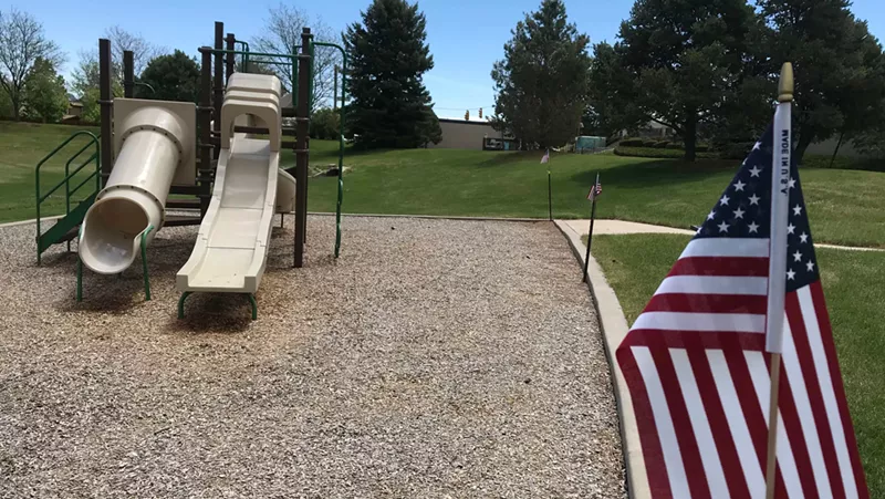 Image: An unknown person removed the yellow caution tape from a Jefferson County playground and put up American flags in its place.