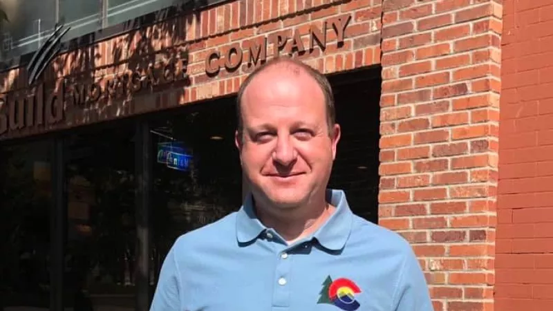 Image: Governor Jared Polis at a food pickup spot in Grand Junction earlier this year.