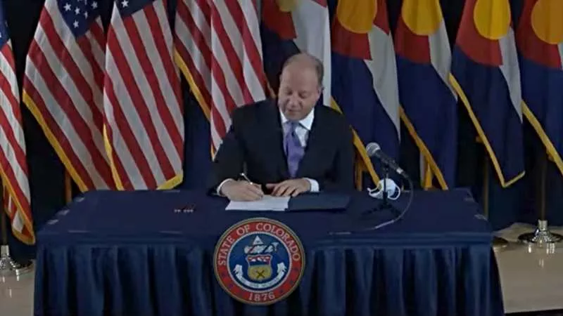 Image: Colorado Governor Jared Polis at a bill-signing ceremony earlier this week.