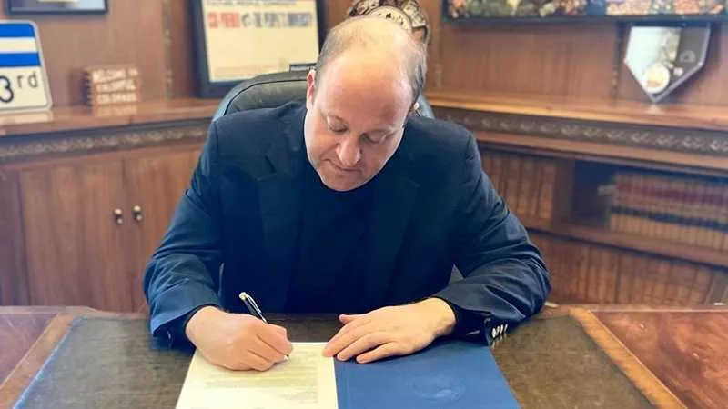 Image: Colorado Governor Jared Polis on the job.