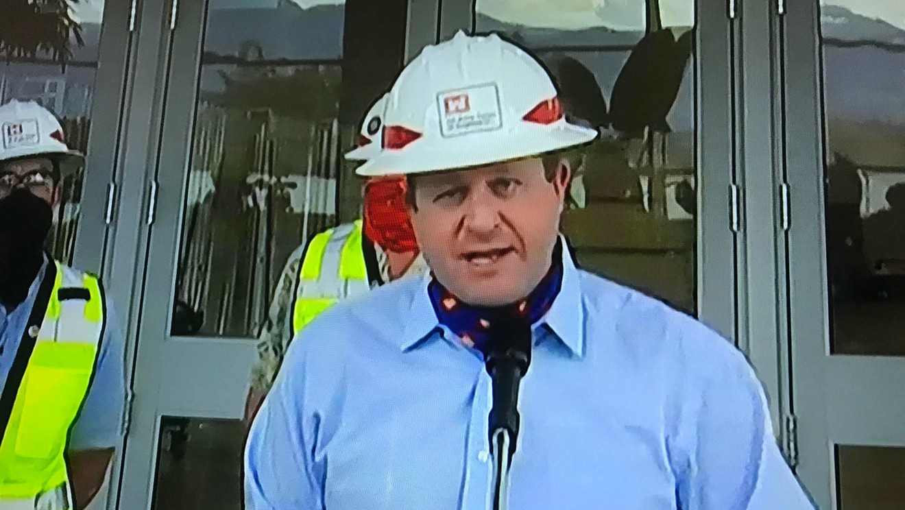 Colorado Governor Jared Polis donned a hard hat during his April 10 press conference.