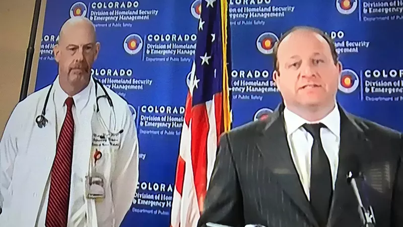 Image: Governor Jared Polis was joined at his March 30 press conference by the University of Colorado Denver's Dr. Marc Moss.