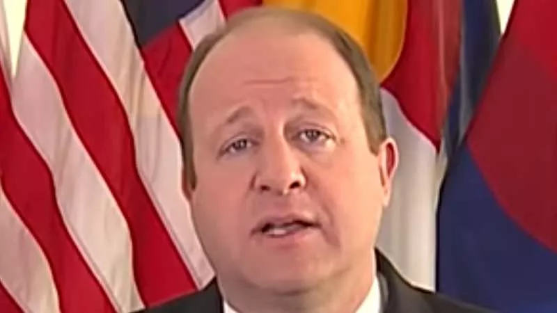 Image: Colorado Governor Jared Polis during a recent press appearance.