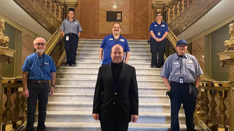 Image: Governor Jared Polis and friends demonstrating proper social distancing at the Colorado State Capitol on March 19.