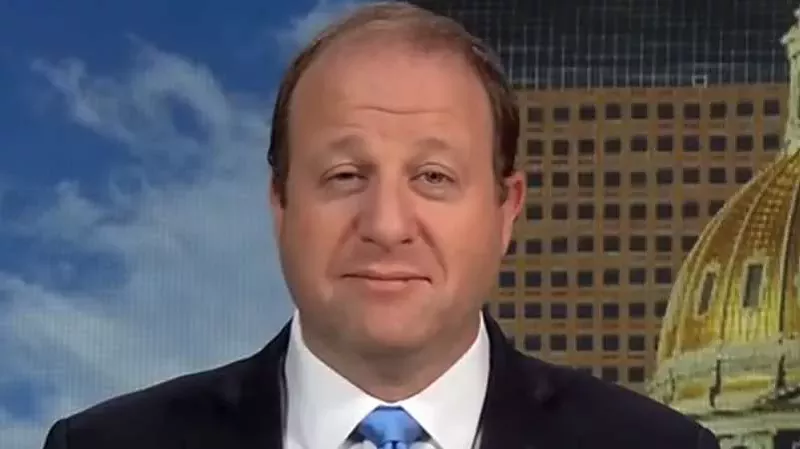 Image: Governor Jared Polis during an interview with CNBC.