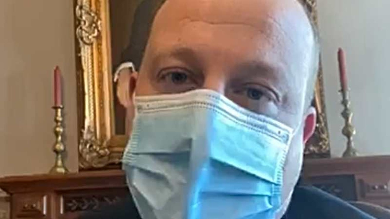 Governor Jared Polis was wearing a mask while waiting in the White House for his meeting with President Donald Trump.