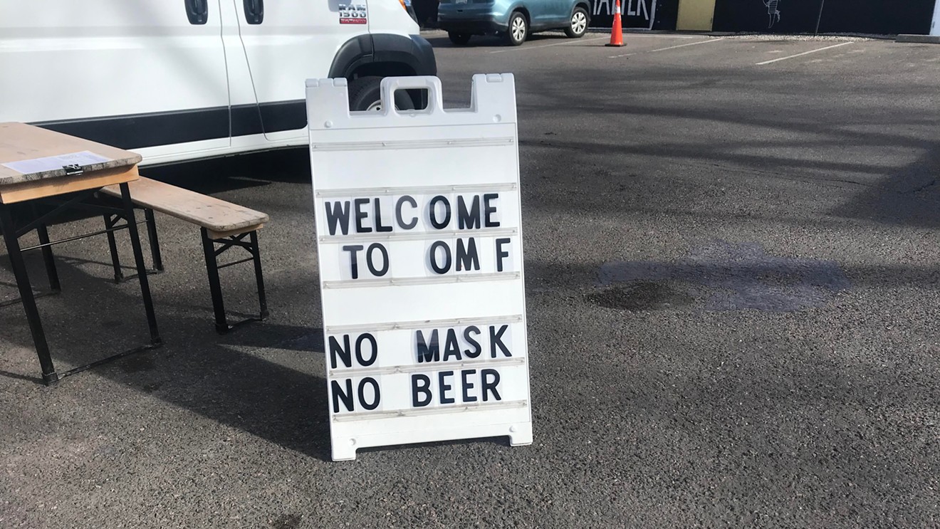 Signs like this one outside a RiNo eatery could soon become a thing of the past.