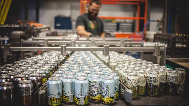 cans of beer in a production facility