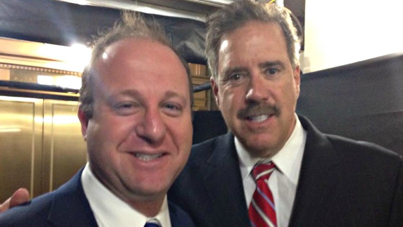 Craig Silverman posing with then-Congressman Jared Polis in 2015.
