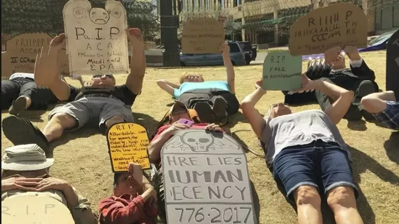 Image: Indivisible Denver members protesting against Republicans' health-care bill earlier this year.